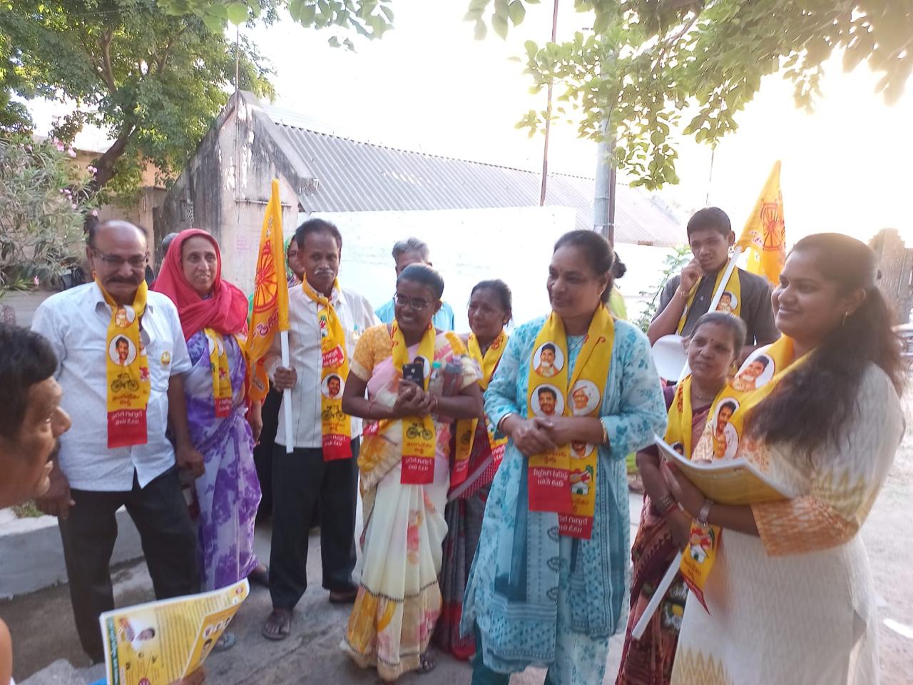 Thejaswi and local volunteers meeting residents